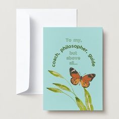 a greeting card with an orange butterfly on the front and green leaves in the back