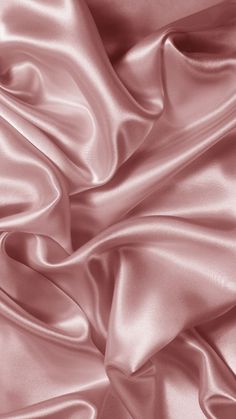 a close up view of a pink satin fabric