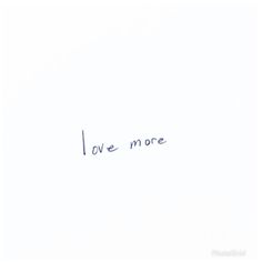 the word love more written in blue ink on a white paper with writing underneath it