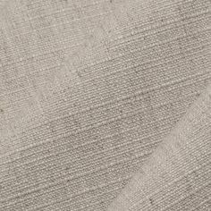 an upholstered fabric textured in neutral colors