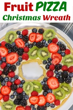 a christmas wreath fruit pizza on a white plate