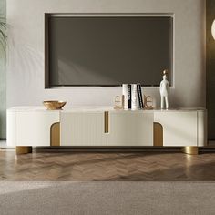 an entertainment center with a large television mounted on it's sideboard in a living room