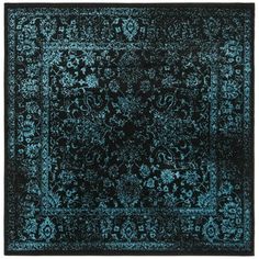 a blue rug with an intricate design on the top and bottom, is shown in black