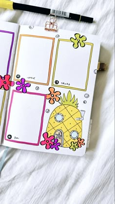 an open planner with pineapples and flowers on it