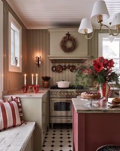 a kitchen filled with lots of counter top space next to a stove top oven and sink