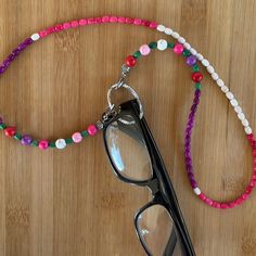 This Post Is For A Hand Crafted Beaded Eyeglass Holder Which Can Also Be Used As A Face Mask Holder. Keep Up With Your Prescription Glasses, Sunglasses, Reading Glasses Or Face Mask With This Eyeglass Necklace. No More Hunting For Your Glasses, Just Put Them In The Loop In This Eyeglass Necklace Holder, Which Is Worn Around Your Neck Just Like Any Necklace.The Beads Are Howlite In An Array Of Sizes And Colors. 6mm, 4mm Colors - Pink, Green, White, Purple, Red Length- 26.5” Loop For Holding Eyeglasses - 1 3/16” If You Want To Use It As A Face Mask Holder, Just Remove The Loop. The Glasses Are Not Included. Handmade By Me. Wear All Year - Winter, Fall, Summer, Spring Match Your Outfit Eyeglass Necklace Holder, Multi Colored Eyes, Face Mask Holder, Handmade Skulls, Eyeglass Necklace, Crochet Eyes, Mask Holder, Necklace Holder, Eyeglass Holder