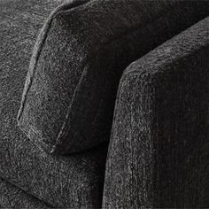 a close up view of the back end of a couch with its arm folded down