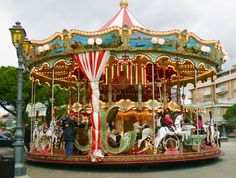 a merry go round with people on it