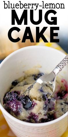 blueberry lemon mug cake in a white bowl with a spoon