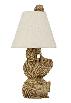 a bear lamp with a white shade on it's head and two bears hugging each other