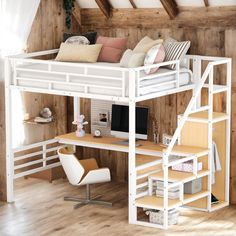 a loft bed with a desk underneath it