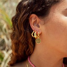 Our Summer State of Mind Earrings are back – the perfect accessory to bring the essence of summer to your look! These earrings, with their stunning gold finish and elegant design, capture the carefree spirit of sunny days and add a dash of elegance to any outfit. - 14k gold plated stainless steel with polished finish - 2.5mm thick, 16mm huggie hoop - Engraved sun design Sun Design, Back Necklace, Sun Designs, Stacked Jewelry, State Of Mind, Gold Finish, Sunny Days, Ring Earrings, Elegant Design