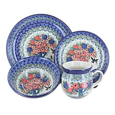 four pieces of blue and white china with flowers on them, one is holding a coffee cup