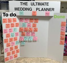 the ultimate wedding planner is displayed on a white board with sticky notes attached to it