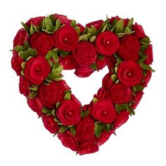 a heart shaped wreath with red flowers and green leaves in the shape of a heart