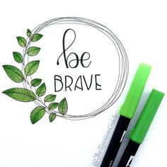 two pens sitting next to each other on top of a white paper with the words be brave