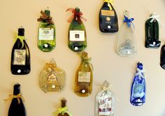 several wine bottles are hanging on the wall