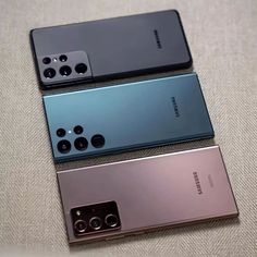 three different models of the samsung foldable camera phone, one in black and one in silver