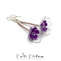 two purple flowers are attached to silver earwires