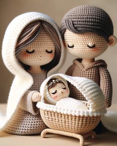 a crocheted nativity scene with two people and a baby