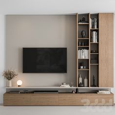 an entertainment center with bookshelves and a flat screen tv mounted on the wall