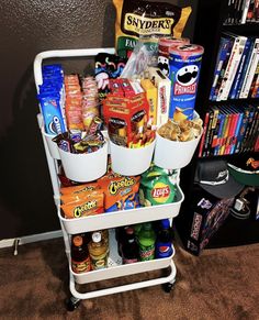 a white cart filled with snacks and other items