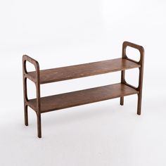 a wooden shelf with two shelves on one side and an oval handle on the other