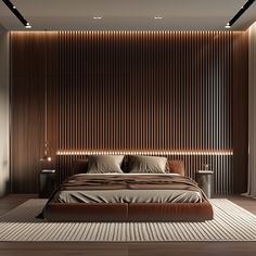 a large bed sitting in the middle of a bedroom next to a wall with wooden slats