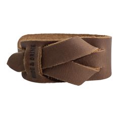 a brown leather bracelet with a knot on it