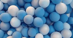 many blue and white balls are scattered together