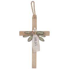 a wooden cross with a ribbon hanging from it's side and the words pray on it