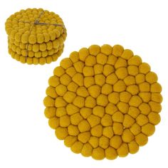 two round yellow cushions sitting on top of each other