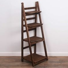 Milltown Merchants Distressed Ladder Shelf - Rustic Leaning Bookshelf - Brown: MILLTOWN MERCHANTS LADDER BOOKSHELF - The Milltown Merchants brown bookshelf comes with a unique rustic finish paired with a clean, modern silhouette. The carefully curated display is great for showcasing photo frames, succulents, art, small house plants, wicker baskets, and books. Create an eye catching display to compliment your unique space with the Milltown Merchants wooden bookshelf! FUNCTIONAL DESIGN - Tradition Sauder Bookcase, Brown Bookshelves, Succulents Art, Leaning Bookshelf, Farmhouse Bookshelf, Traditional Bookcases, Wooden Ladder Shelf, Leaning Bookcase, Driftwood Shelf