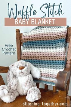 a crocheted baby blanket sitting on top of a wooden chair next to a stuffed bunny