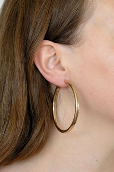 Pauline is the our iconic, staple hoop. She's meant to be seen, loved, and talked about. Pauline is a lightweight, matte finish hoop that can be worn with any outfit for any occasion. - matte finish gold hoop earring - stainless steel post back - 2.5" hoop width, 5mm thickness - hypoallergenic - nickel free Modern Matte Gold Hoop Earrings For Everyday, Matte Gold Modern Hoop Earrings For Everyday, Matte Gold Minimalist Hoop Earrings For Everyday, Matte Gold Hoop Earrings, Mya Harrison, Daisy Choker, Gold Hoop Earring, Poppy Color, Steel Post