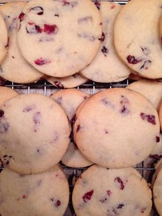 a bunch of cookies that are cooling on a rack