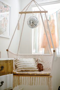 a white hammock hanging from the ceiling