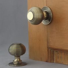 a door handle and knob on a wooden door