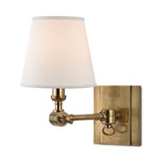 a wall light with a white shade on it's side and a gold finish