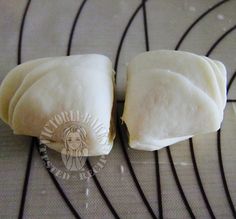 two pieces of food sitting on top of a table