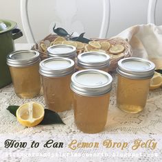 six jars of lemon drop - off sitting on a table