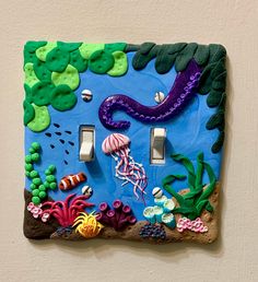 a light switch cover with sea life on it