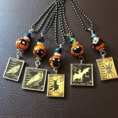 the necklaces are decorated with charms and pictures on them, including ladybug