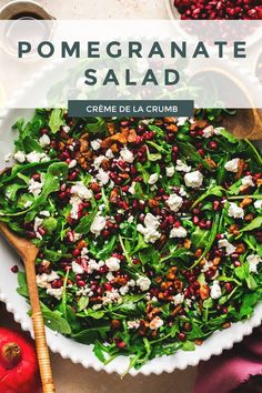 a salad with feta cheese and pomegranate on top in a bowl