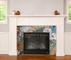 the fireplace is decorated with flowers and leaves