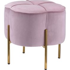 a pink velvet stool with gold legs