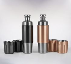 four different colored stainless steel tumblers and cups