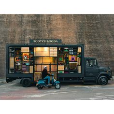 a scooter is parked in front of a store