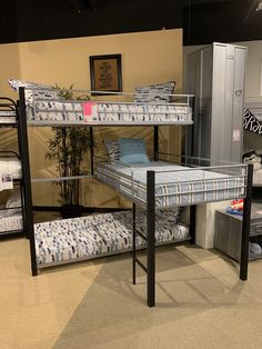 bunk beds and mattresses are on display in a store