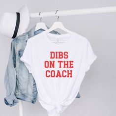 Dibs On The Coach Shirt UNISEX T-Shirt Bella+Canvas 3001 .: 100% Airlume combed and ringspun cotton .: Light fabric (4.2 oz/yd² (142 g/m .: Runs true to size Shipping policies ❤️ TURN-AROUND TIME: Our current processing time is 3-7 days (not including shipping time). ❤️ SHIPPING: Our packages are shipped with USPS First Class Shipping times (not including processing times): First Class: 2-10 business days ❤️ Returns & exchanges I don't accept returns, exchanges, or cancellations All sales ar Dibs On The Coach Shirt, Dibs Shirt, Coaches Wife Shirt, Dibs On The Coach, Football Girlfriend Shirts, Baseball Wife, Basketball Shirt Designs, Farm Girl Shirt, Coaches Wife